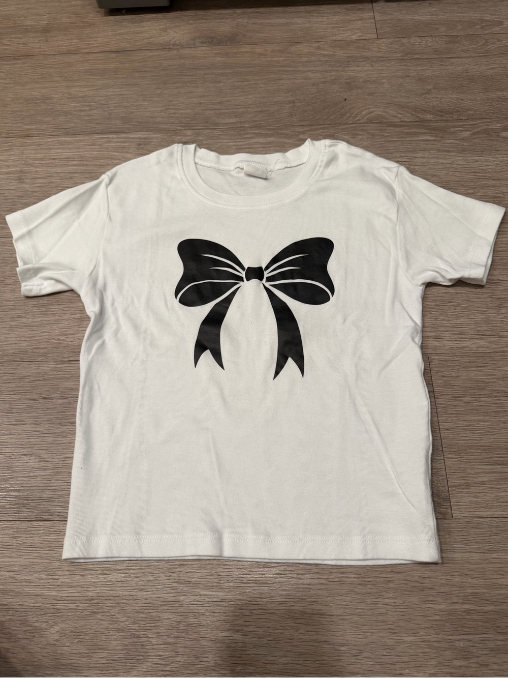 Woman White T-Shirt with Black Bow Graphic